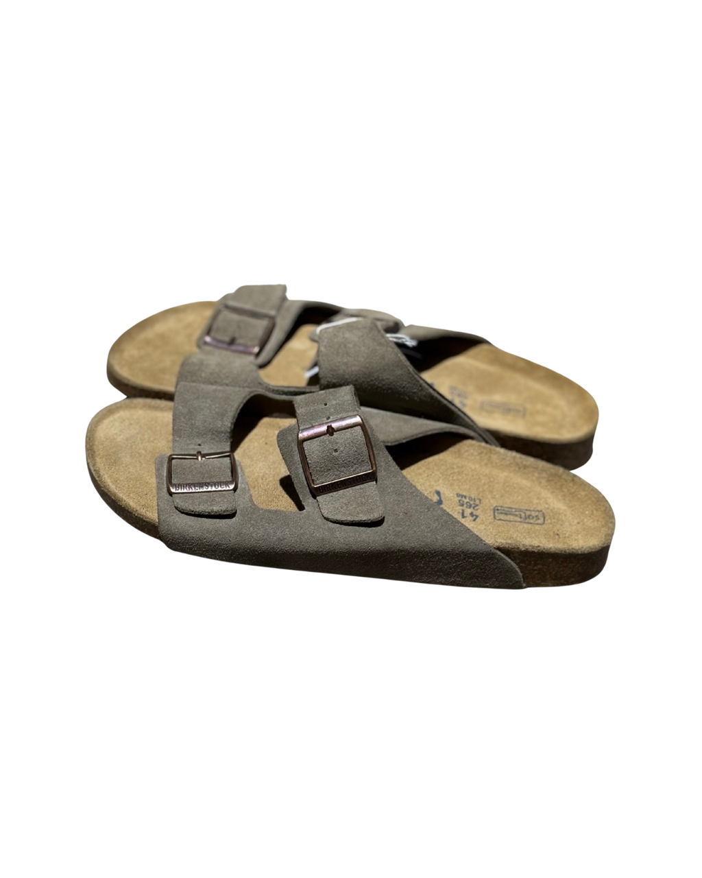 Pair of brown sandals with straps on a white background