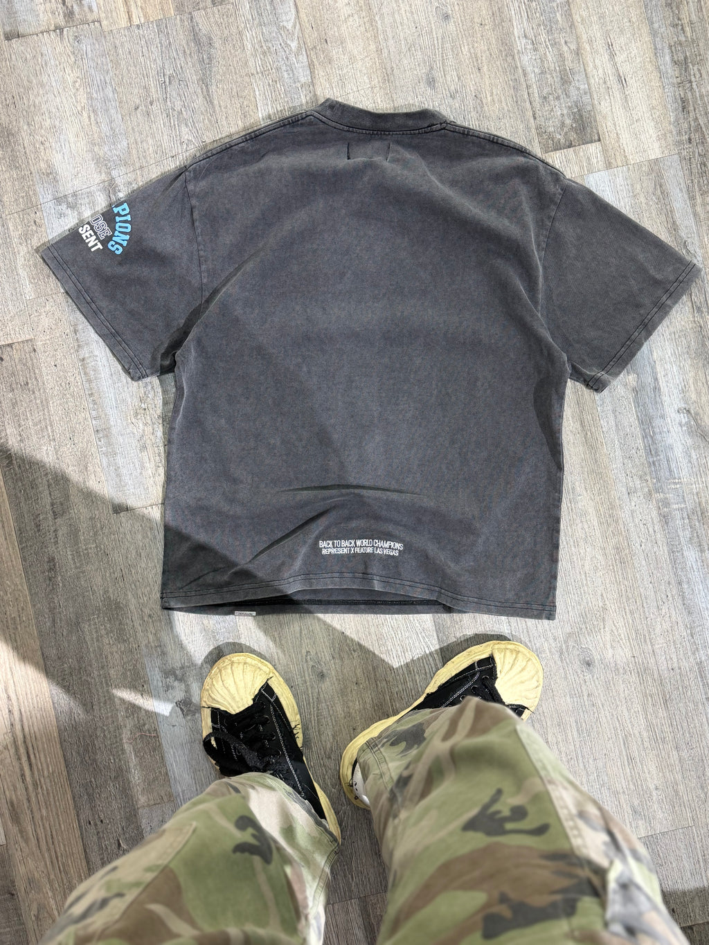 Represent “World Champions” Graphic T-Shirt – Washed Black