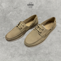 Sand-coloured boat shoes with lace-up fronts, moc-toe stitching and contrasting light soles