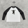 Front of white raglan long-sleeve T-shirt with black sleeves and bear chest graphic.