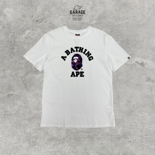 White crew-neck T-shirt with black A BATHING APE lettering and purple camouflage ape-head chest graphic