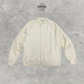 Cream textured bomber-style jacket with tonal button front, raglan sleeves and ribbed trims