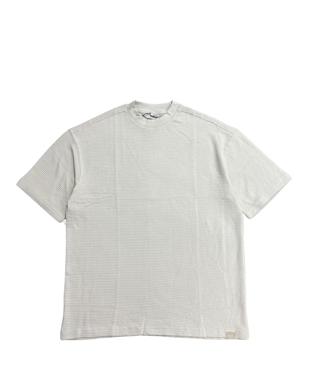 White t-shirt with subtle pattern on a white background